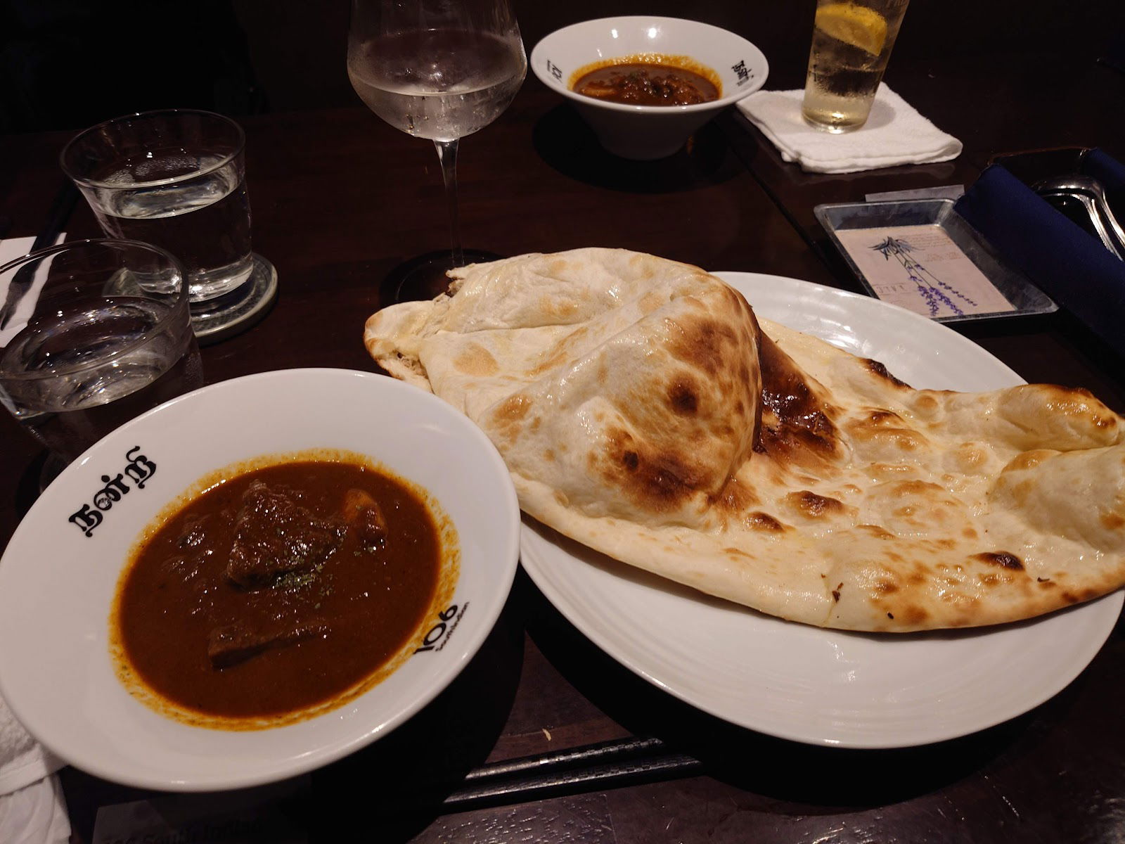 Delicious naan bread with savory curry at Indian restaurant