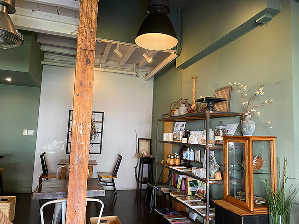 Cozy café interior with wooden tables and decor shelves