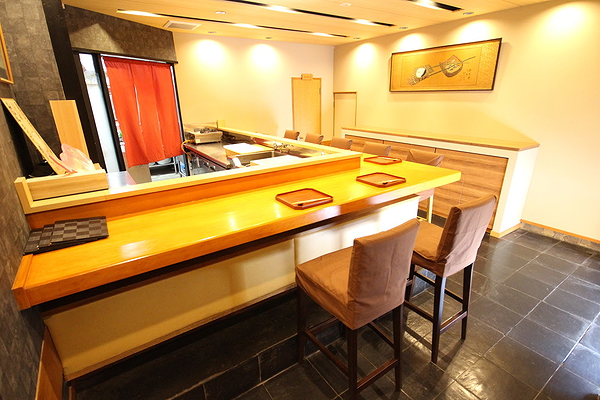 Modern restaurant interior with wooden sushi bar and cozy seating