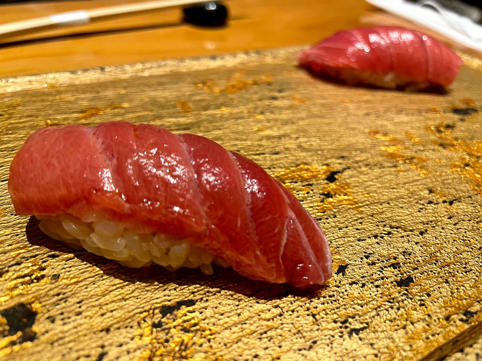 A close-up shot of fresh fish laid over rice: nigiri sushi at Sushi Tokyo Ten Shinjuku NeWoMan.