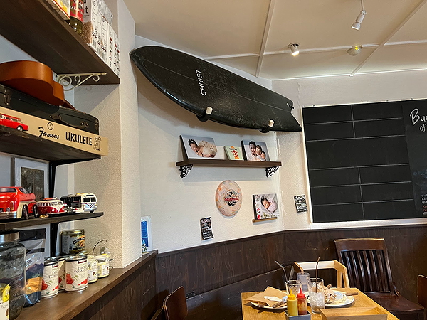 Cozy restaurant interior with eclectic wall decor and wooden table