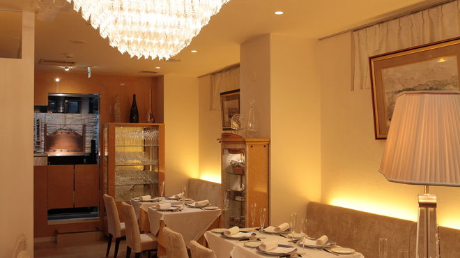 Elegant restaurant interior with soft lighting and set tables