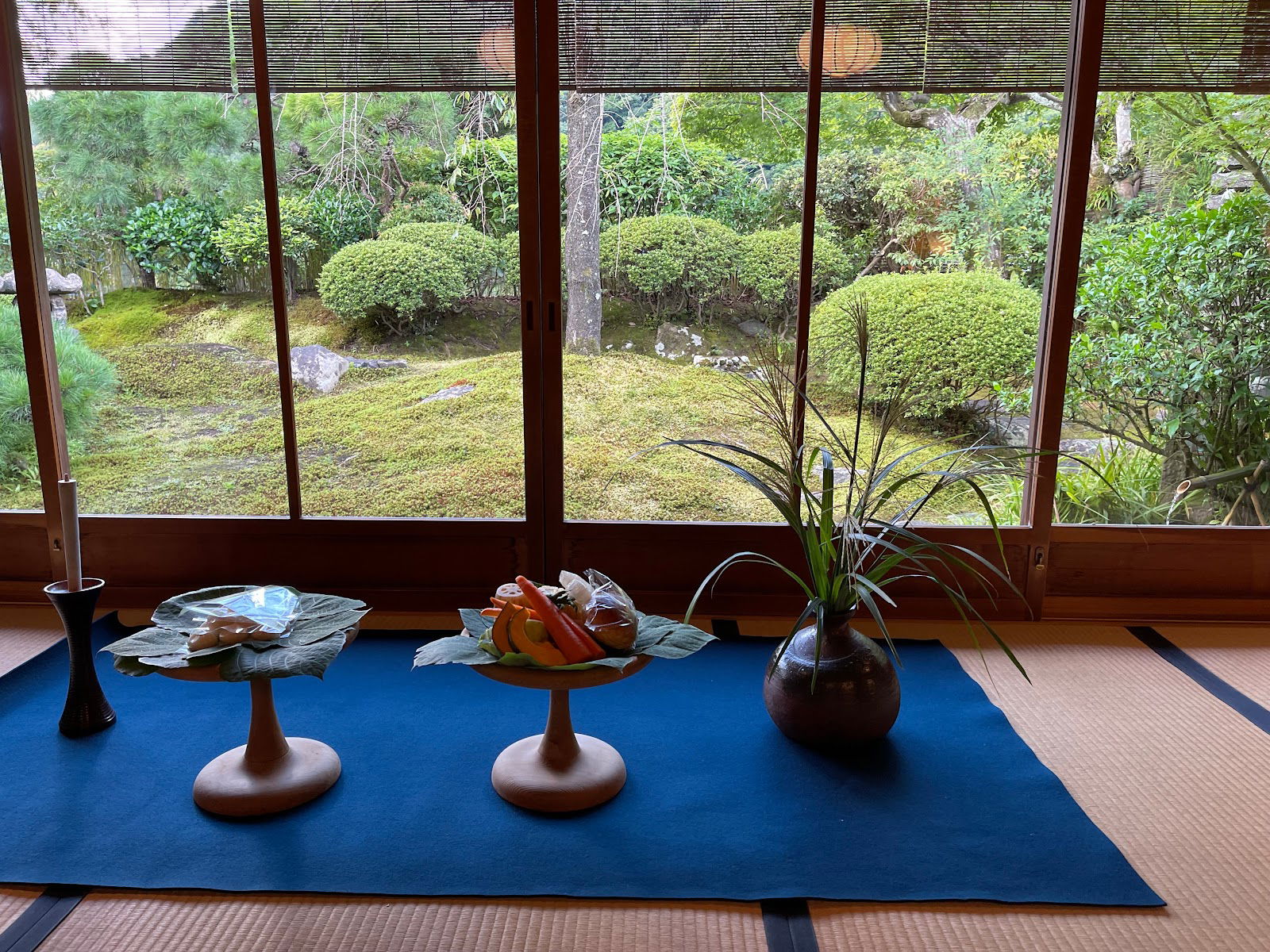 The elegant dining area of Kyoto Kitcho Arashiyama, looking out into a Japanese garden.