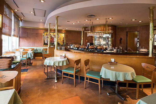 Elegant restaurant interior with cozy dining setup and warm lighting