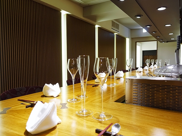 Elegant restaurant table with wine glasses and folded napkins