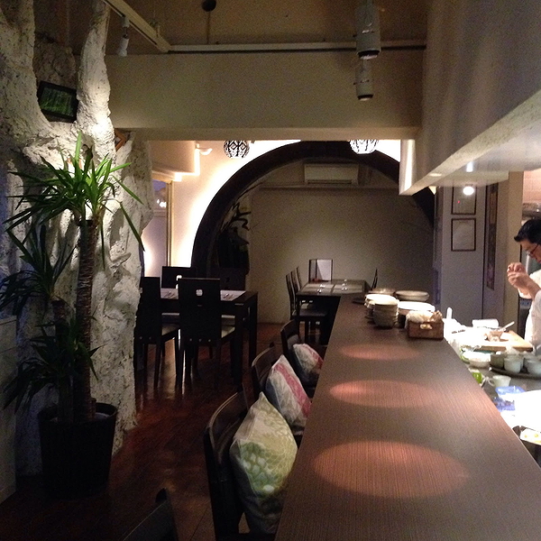 Cozy modern restaurant interior with bar seating and ambient lighting