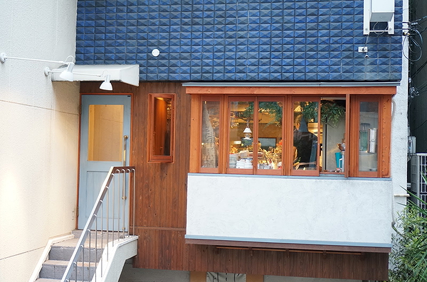 Charming restaurant exterior with large windows and warm lighting