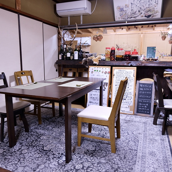 Cozy restaurant interior with wooden tables and menu board