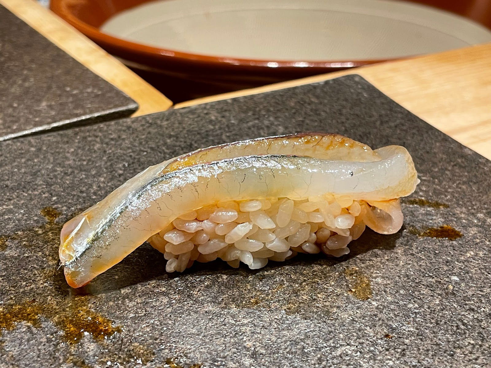 A serving of nigiri sushi at Sushi Ohata, glistening with soy sauce.