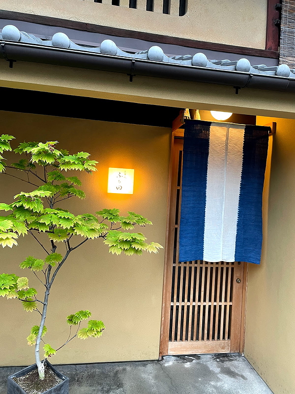 Charming Japanese restaurant entrance with traditional noren