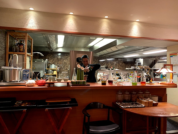 Chef creating cocktails at modern restaurant bar