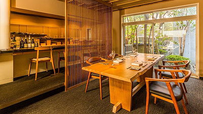 Elegant modern restaurant dining area with wooden furniture