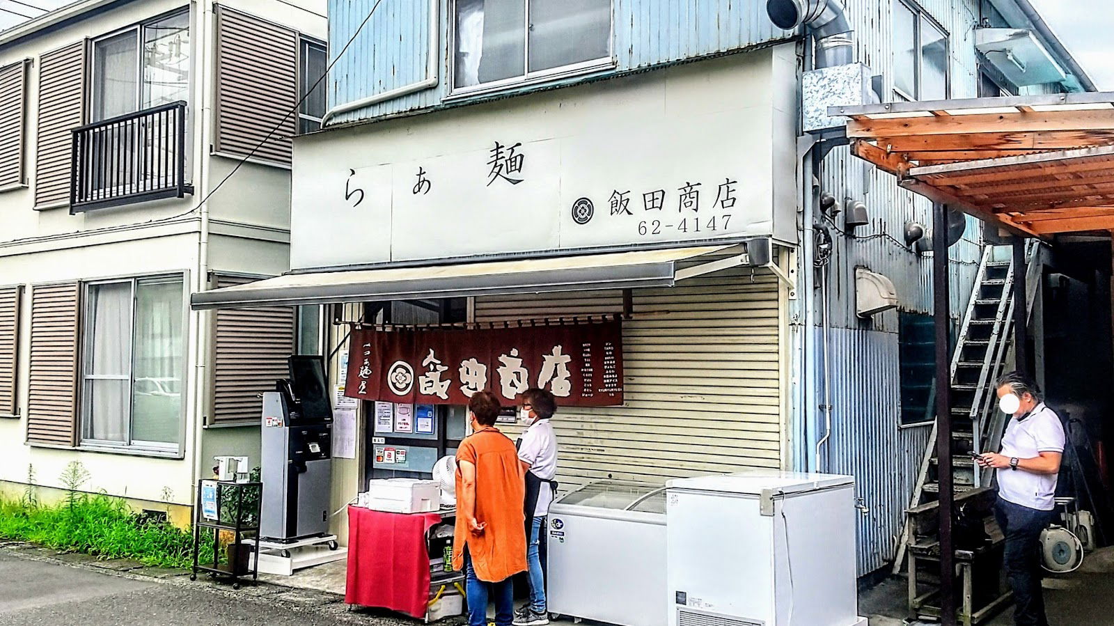 Quaint ramen shop exterior with vintage charm and street view