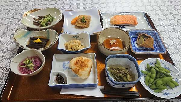 Traditional Japanese meal with assorted dishes on a tray
