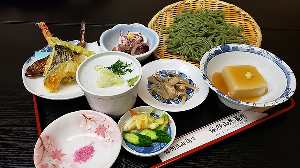 Japanese restaurant table setting with traditional dishes