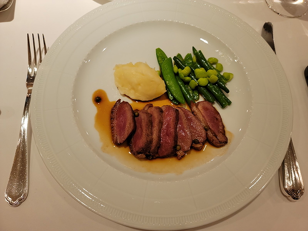 Gourmet duck breast with mashed potatoes and green beans