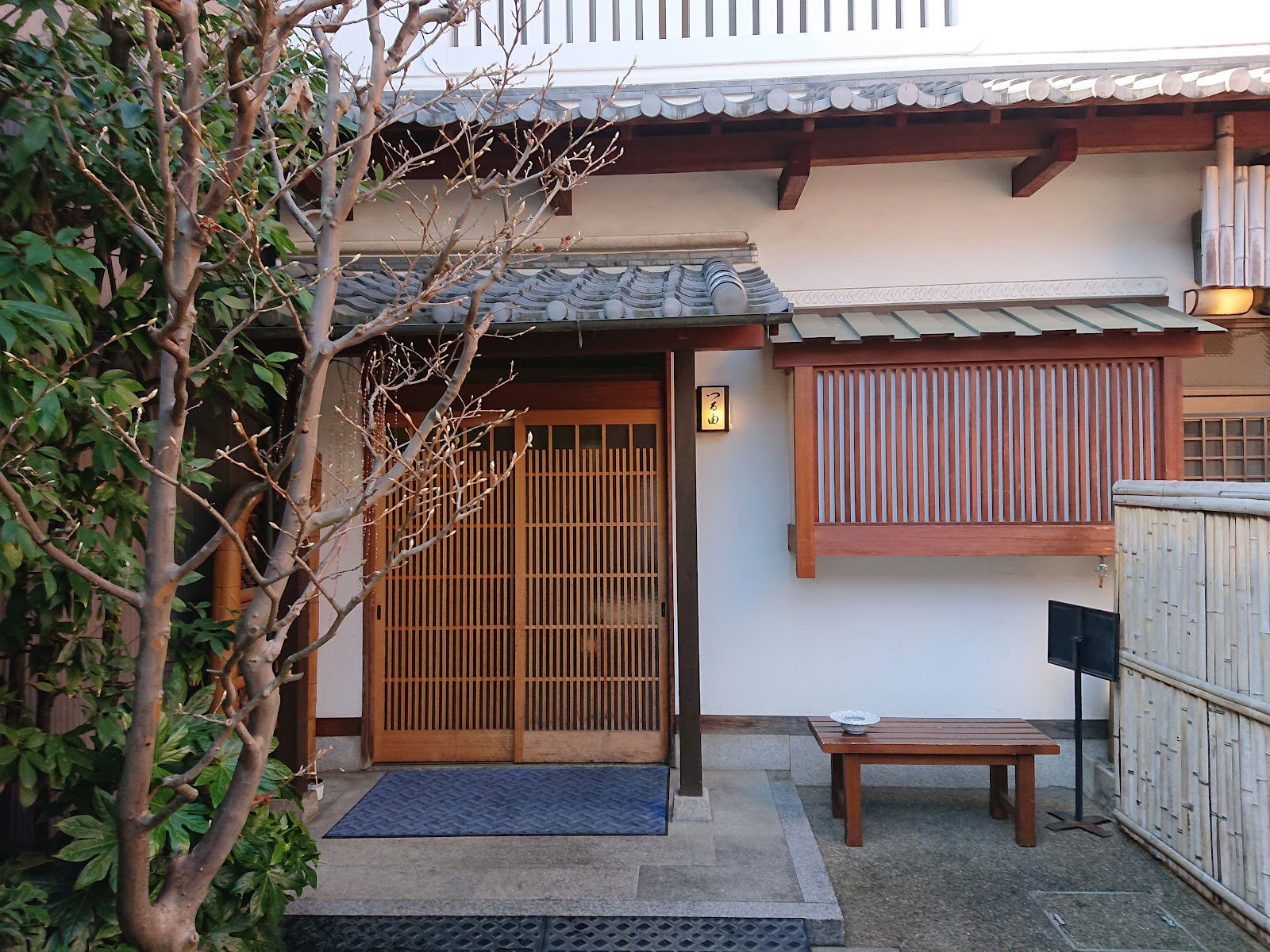 Traditional Japanese restaurant entrance with wooden sliding doors