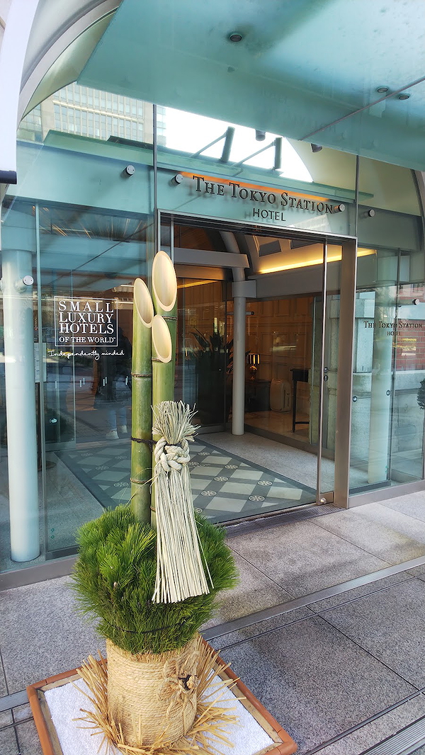Elegant hotel entrance with traditional bamboo decoration