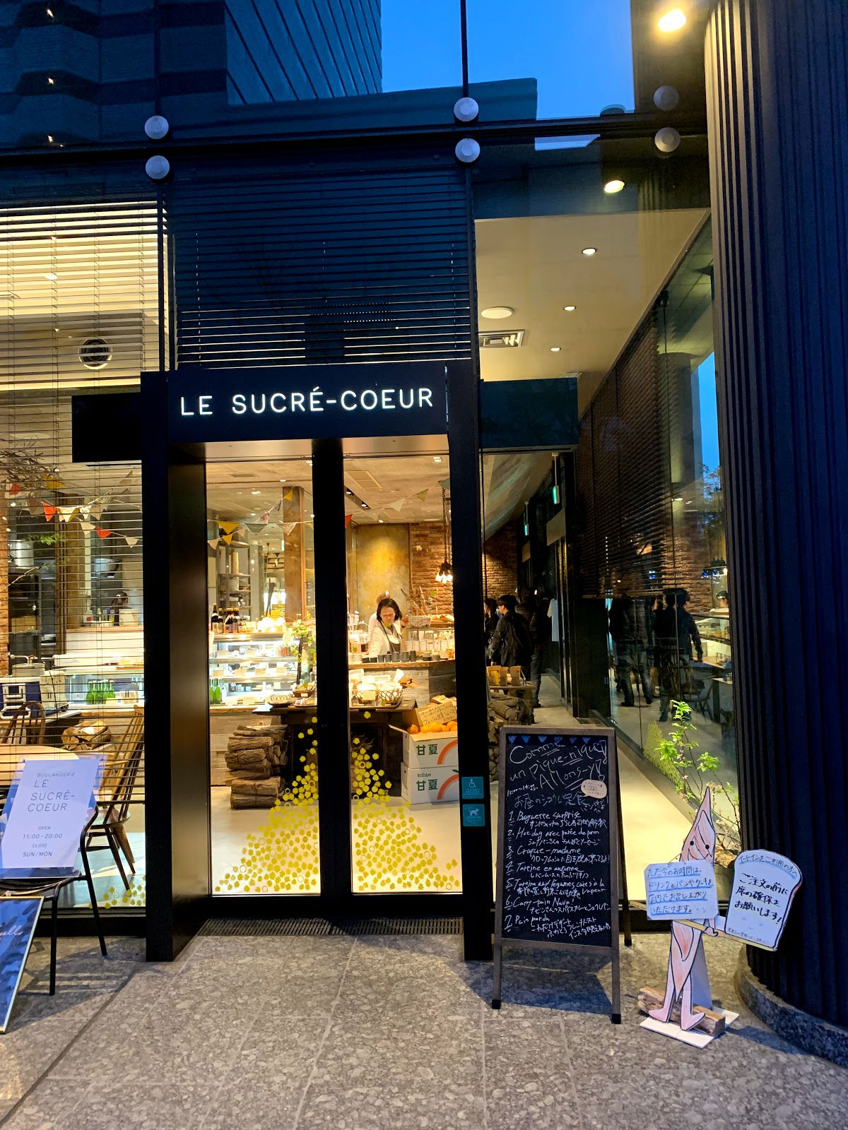 Chic bakery entrance with warm lighting and inviting decor
