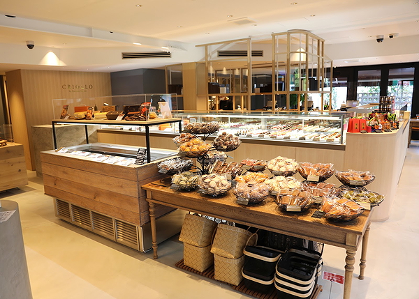 Modern bakery display with assorted pastries and bread