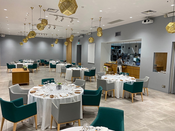 Elegant restaurant dining area with modern decor and round tables