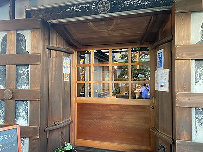 Rustic wooden entrance to cozy restaurant setting