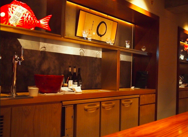 Warm, stylish restaurant bar with elegant lighting and decor