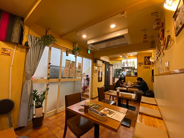 Cozy restaurant interior with wooden tables and warm lighting