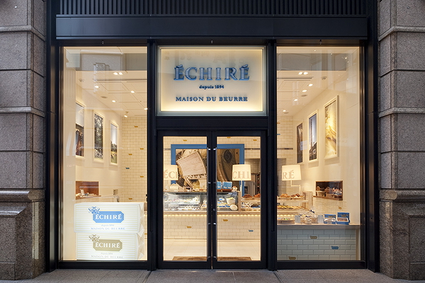 Elegant restaurant storefront with illuminated interior design