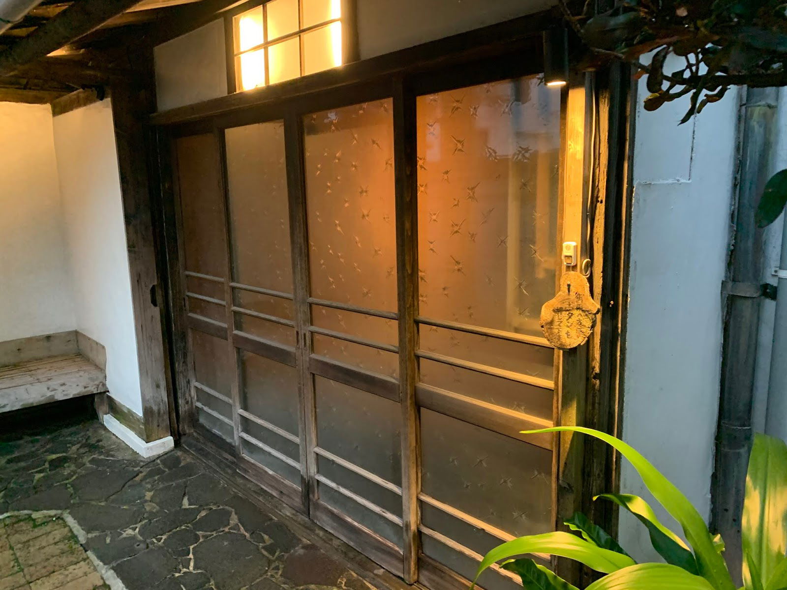 Cozy restaurant entrance with traditional wooden door