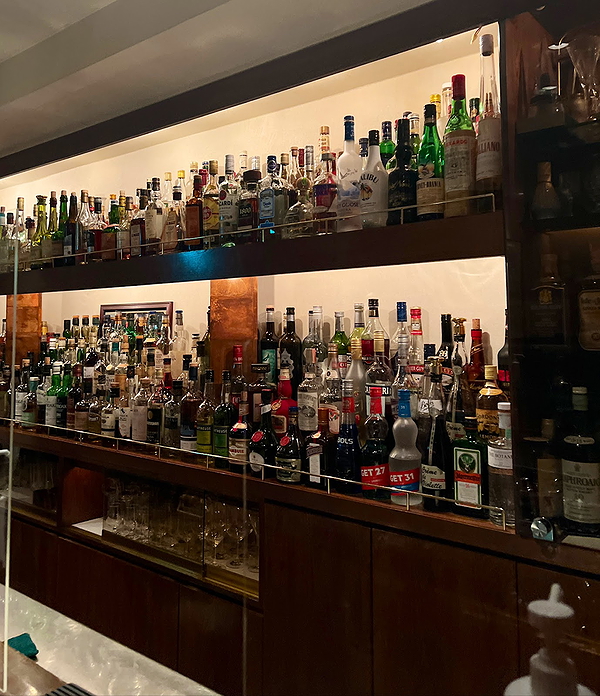Elegant bar with a wide selection of spirits and liquors on display