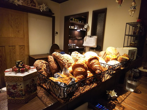 Cozy bakery counter with fresh pastries and bread display