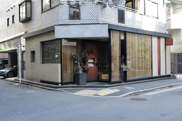 Modern restaurant exterior with sleek design and glass paneling