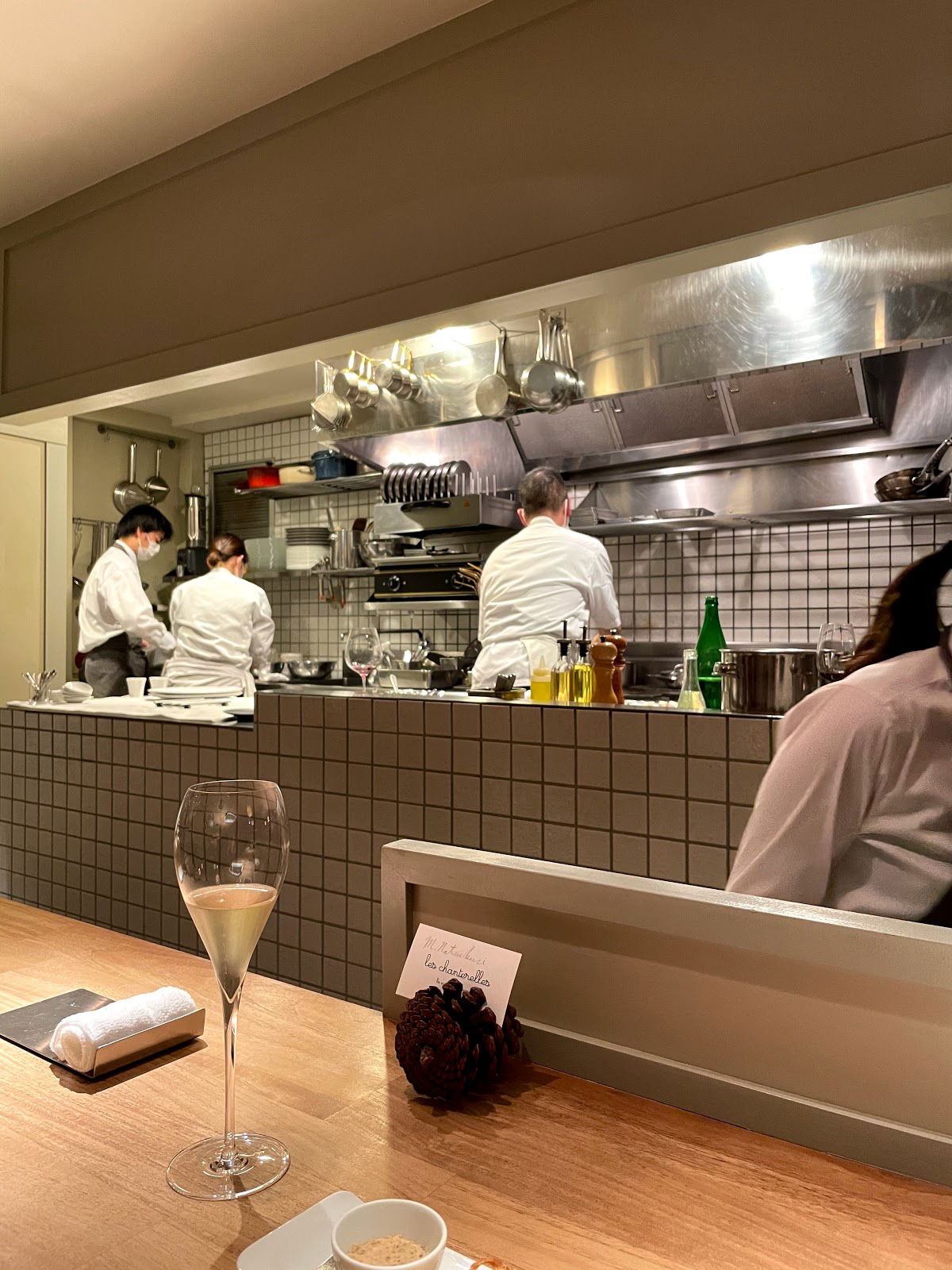 Chefs in a modern open kitchen of a fine dining restaurant