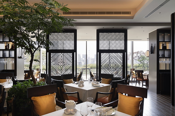 Elegant restaurant interior with window view and intricate decor
