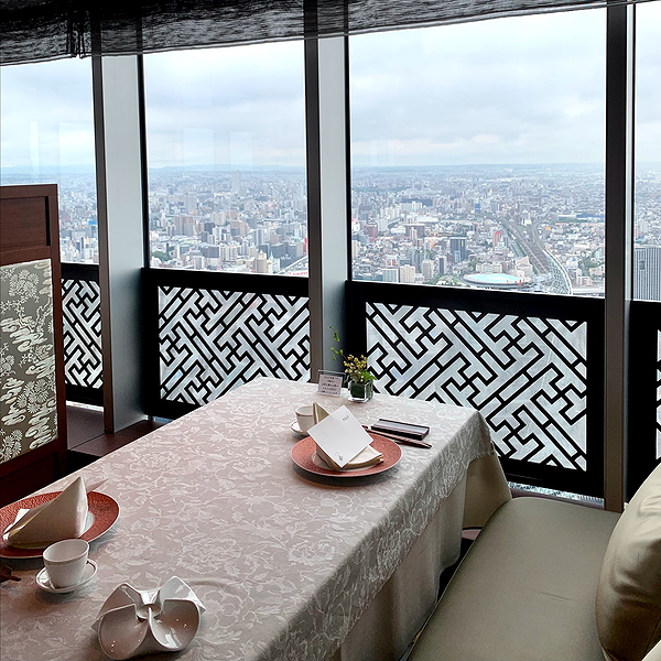 Elegant restaurant table with panoramic city view