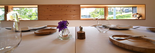 Elegant dining table setup with window view at a modern restaurant