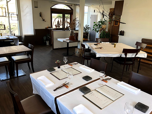 Elegant restaurant interior with set dining tables and modern decor
