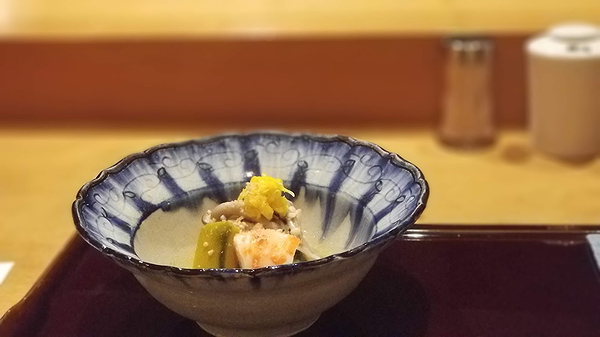 Elegant gourmet dish in a stylish ceramic bowl at a fine dining restaurant