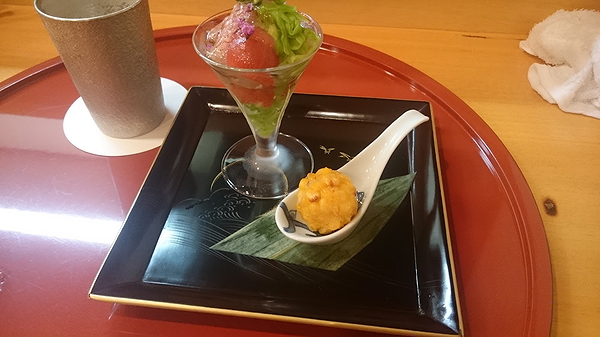 Elegant restaurant plating featuring a gourmet salad and appetizer
