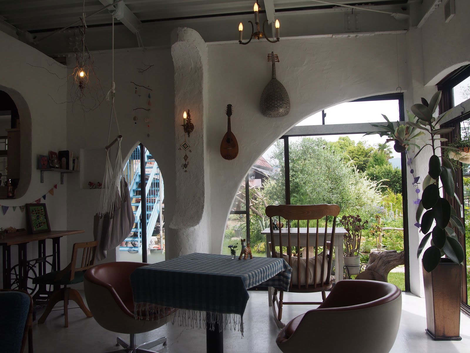 Cozy restaurant interior with rustic decor and garden view