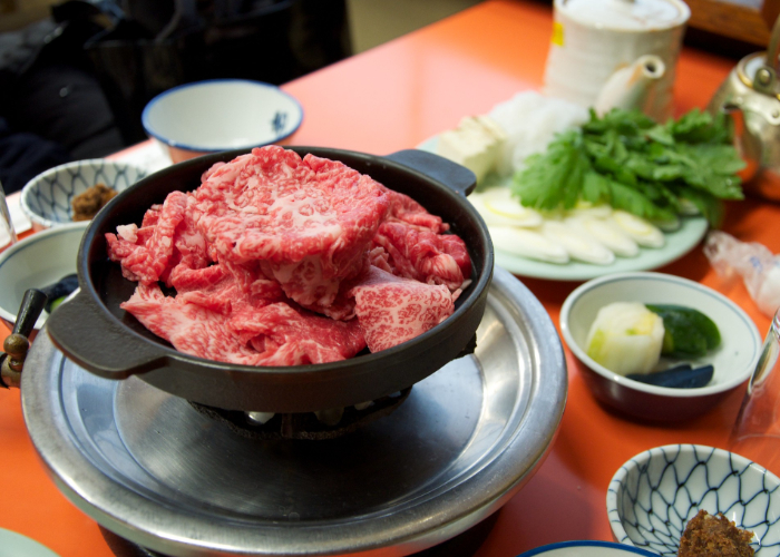Japanese gyu-nabe (beef hot pot) in a cast iron pot