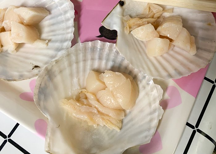 three scallops in shells