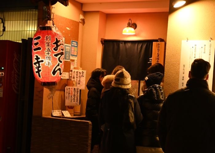 a line of customers waiting outside oden-ya Miyuki