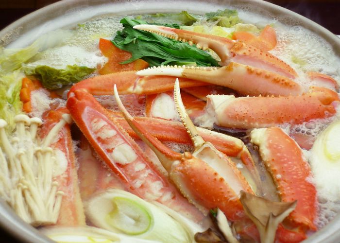 A pot fill of vegetables and crab to make kani nabe