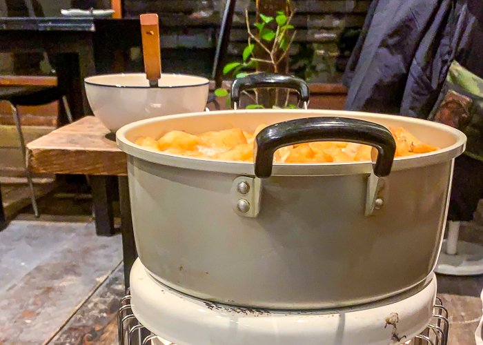 A pot of oden sitting on a heater