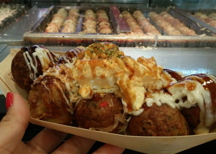 Takoyaki from Gindako with the griddles behind covered in oil