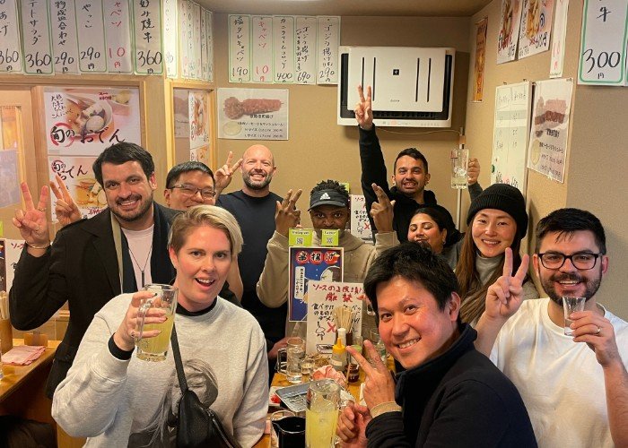 people enjoy a food tour in shinjuku