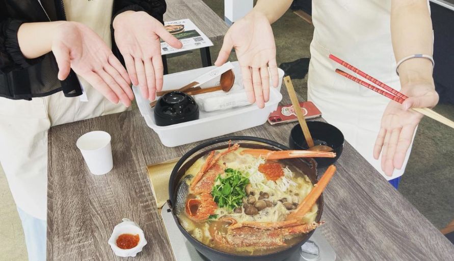 Guests showing off what they made in a Yamanashi cooking class.