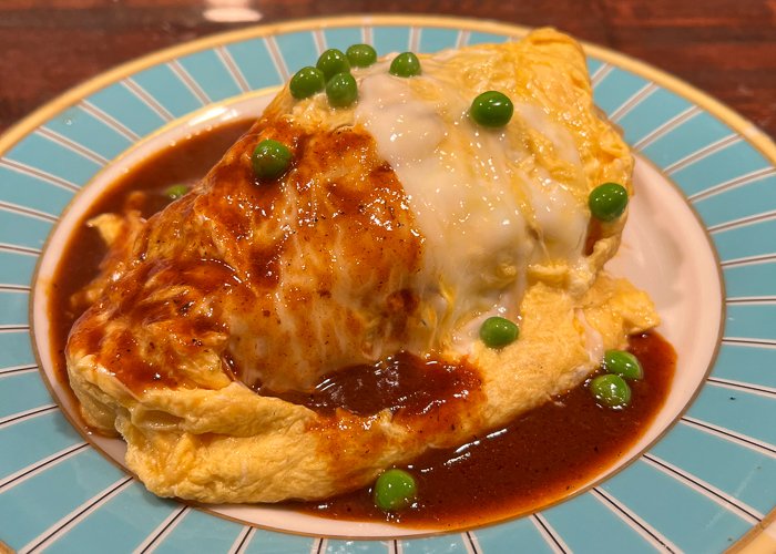 Omurice on a blue and white plate